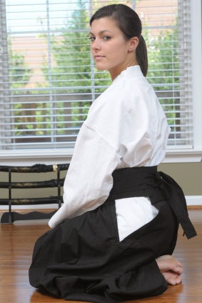 Martial artist seated.